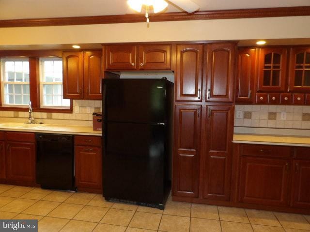 612 S Thomas St, Bedford, PA 15522 - kitchen featuring black appliances, a sink, light countertops, backsplash, and crown molding