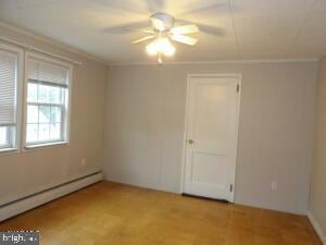 612 S Thomas St, Bedford, PA 15522 - spare room with baseboard heating and ceiling fan