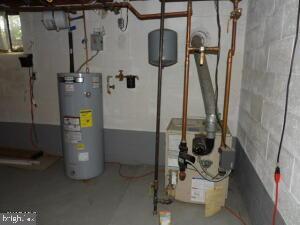 612 S Thomas St, Bedford, PA 15522 - utilities featuring electric water heater and a heating unit