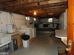 612 S Thomas St, Bedford, PA 15522 - below grade area featuring washing machine and clothes dryer
