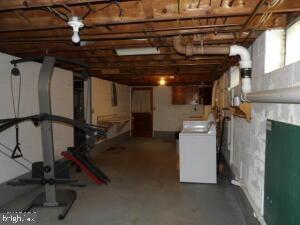 612 S Thomas St, Bedford, PA 15522 - below grade area with washer / clothes dryer