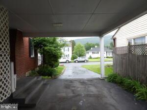 612 S Thomas St, Bedford, PA 15522 - view of patio / terrace with an attached carport and asphalt driveway