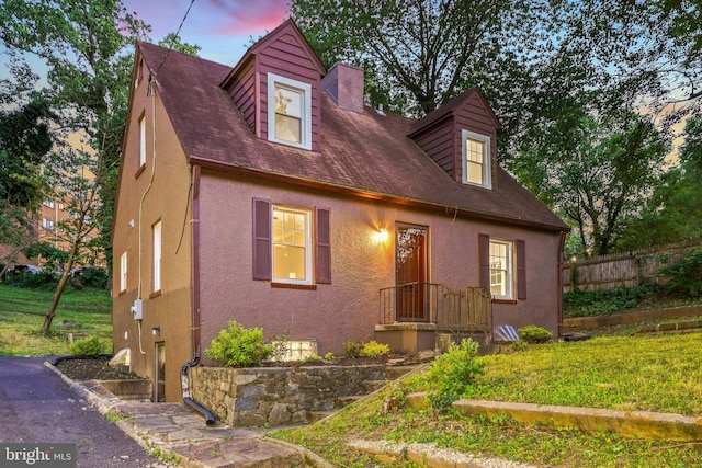 514 Silver Spring Ave, Silver Spring, MD 20910 - cape cod-style house featuring stucco siding, a chimney, and roof with shingles