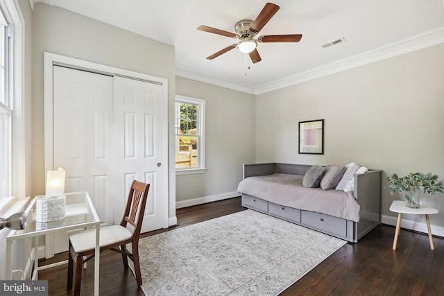 514 Silver Spring Ave, Silver Spring, MD 20910 - bedroom featuring a closet, dark wood-type flooring, baseboards, ornamental molding, and a ceiling fan