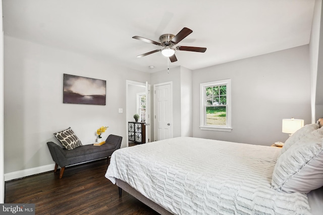 514 Silver Spring Ave, Silver Spring, MD 20910 - bedroom with baseboards, dark wood-style flooring, and a ceiling fan