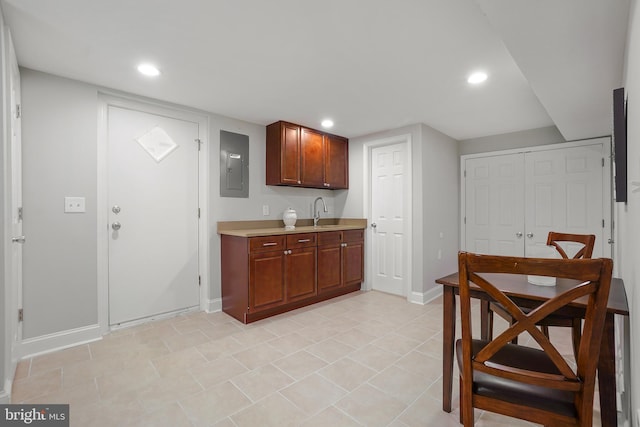 514 Silver Spring Ave, Silver Spring, MD 20910 - kitchen featuring electric panel, light countertops, a sink, baseboards, and recessed lighting