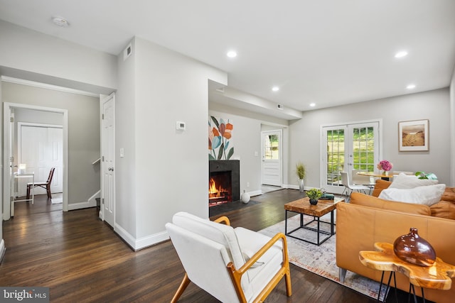 514 Silver Spring Ave, Silver Spring, MD 20910 - living room with dark wood-style flooring, a fireplace with flush hearth, recessed lighting, and baseboards