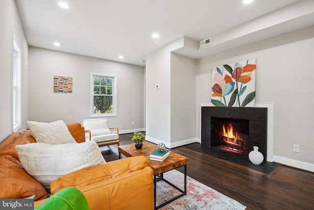 514 Silver Spring Ave, Silver Spring, MD 20910 - living room featuring a fireplace with flush hearth, wood finished floors, recessed lighting, and baseboards