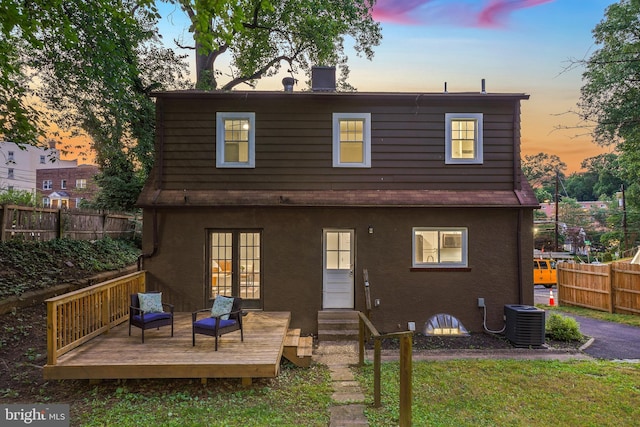514 Silver Spring Ave, Silver Spring, MD 20910 - back of property at dusk with french doors, central AC, and a deck