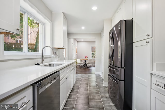 514 Silver Spring Ave, Silver Spring, MD 20910 - kitchen featuring appliances with stainless steel finishes, a sink, white cabinetry, and recessed lighting