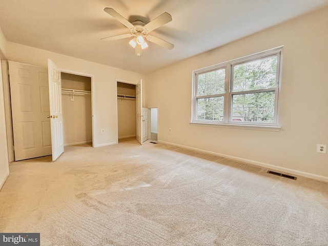 3500 Sugar Maple Ct, Waldorf, MD 20602 - unfurnished bedroom with two closets, baseboards, light colored carpet, and ceiling fan