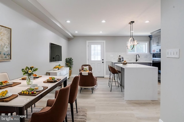 5002 Chalgrove Ave, Baltimore, MD 21215 - dining room with recessed lighting, light wood-type flooring, and a chandelier