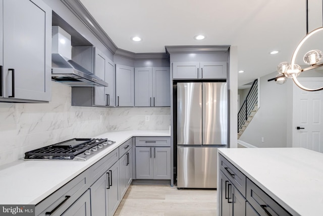5002 Chalgrove Ave, Baltimore, MD 21215 - kitchen with appliances with stainless steel finishes, gray cabinetry, wall chimney range hood, tasteful backsplash, and recessed lighting