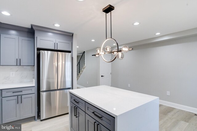 5002 Chalgrove Ave, Baltimore, MD 21215 - kitchen featuring freestanding refrigerator, gray cabinetry, light wood-style floors, recessed lighting, and light countertops