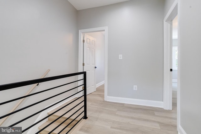 5002 Chalgrove Ave, Baltimore, MD 21215 - corridor with an upstairs landing, light wood-style flooring, and baseboards