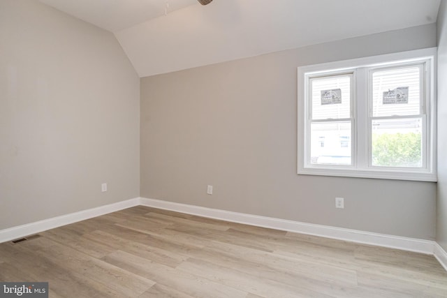 5002 Chalgrove Ave, Baltimore, MD 21215 - unfurnished room featuring a ceiling fan, light wood-style floors, baseboards, and vaulted ceiling
