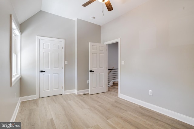 5002 Chalgrove Ave, Baltimore, MD 21215 - unfurnished bedroom featuring light wood finished floors, baseboards, vaulted ceiling, and ceiling fan