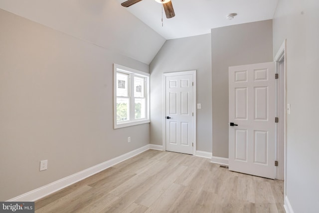 5002 Chalgrove Ave, Baltimore, MD 21215 - unfurnished bedroom featuring light wood-style floors, lofted ceiling, baseboards, and a ceiling fan