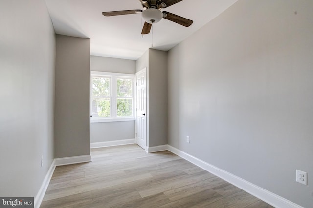 5002 Chalgrove Ave, Baltimore, MD 21215 - unfurnished room with wood finished floors, a ceiling fan, and baseboards