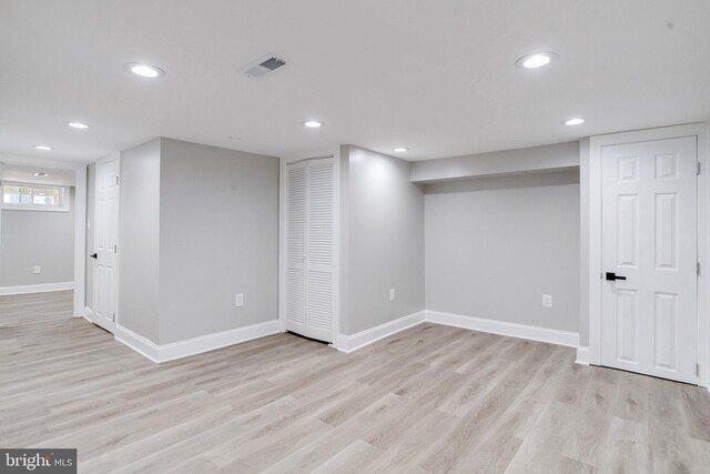 5002 Chalgrove Ave, Baltimore, MD 21215 - below grade area with light wood-type flooring, recessed lighting, and baseboards
