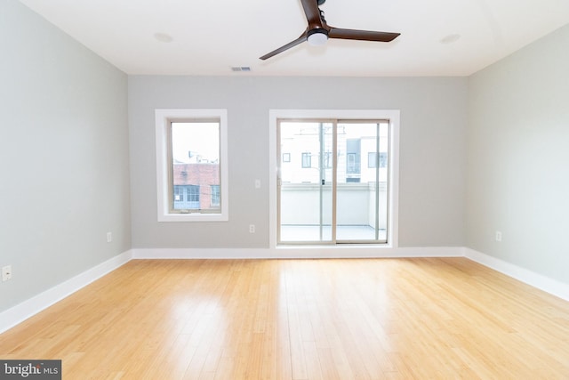 618 N American St, Philadelphia, PA 19123 - spare room with a ceiling fan, light wood-style flooring, and baseboards