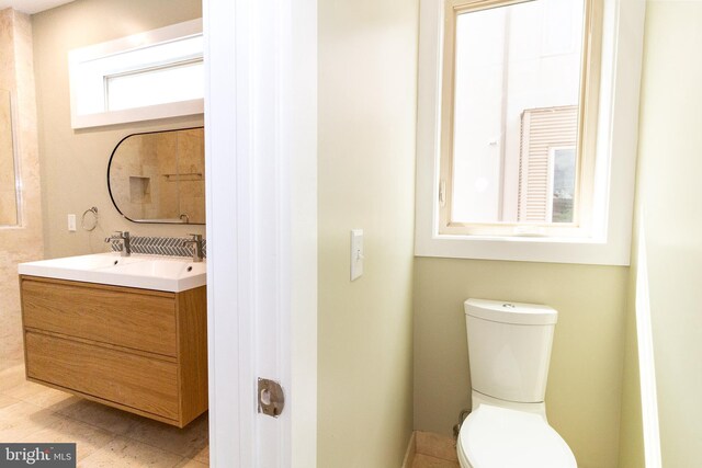 618 N American St, Philadelphia, PA 19123 - bathroom with toilet, double vanity, and tile patterned flooring