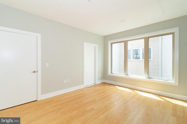 618 N American St, Philadelphia, PA 19123 - spare room featuring wood finished floors and baseboards