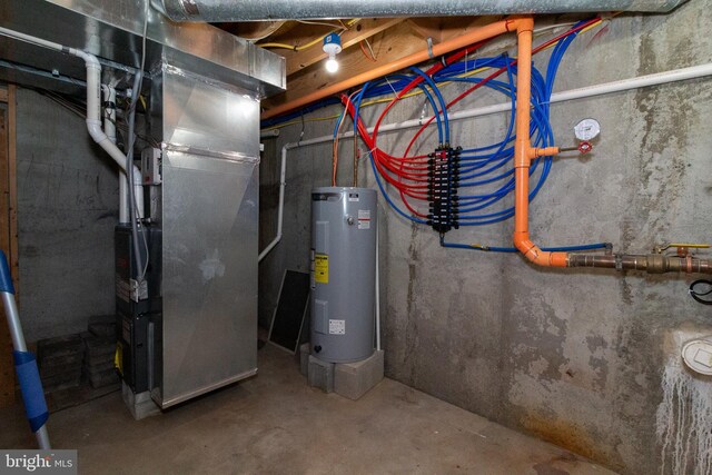 618 N American St, Philadelphia, PA 19123 - utility room featuring electric water heater and heating unit