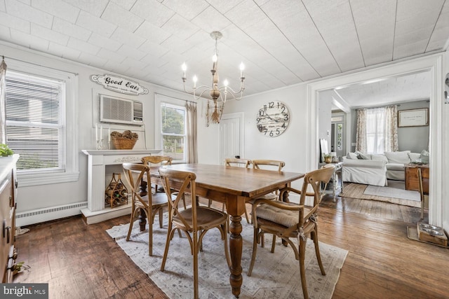 389 Cypress St, Millington, MD 21651 - dining space with a chandelier, a baseboard heating unit, hardwood / wood-style floors, a wall mounted air conditioner, and crown molding