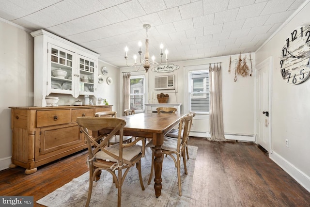 389 Cypress St, Millington, MD 21651 - dining space with ornamental molding, dark wood-type flooring, a chandelier, an AC wall unit, and baseboards