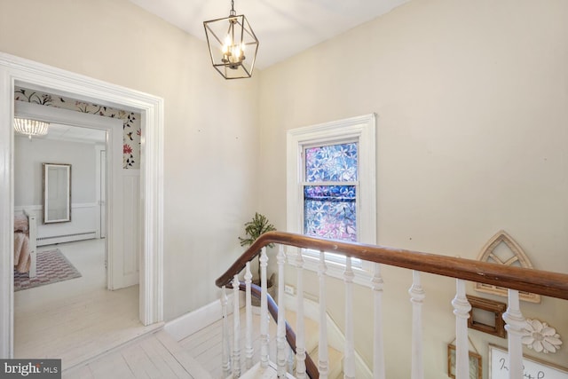 389 Cypress St, Millington, MD 21651 - stairs with a chandelier and a baseboard heating unit