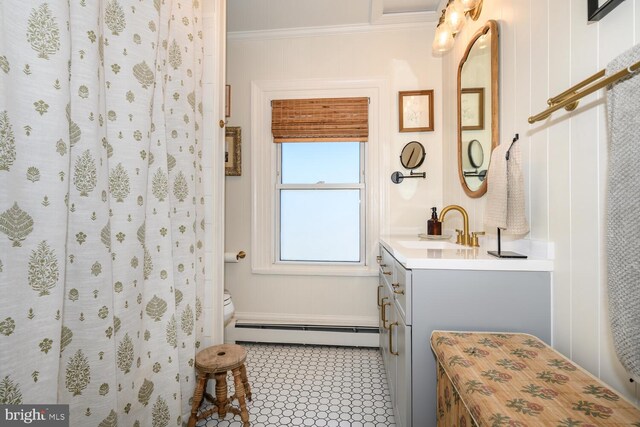 389 Cypress St, Millington, MD 21651 - full bathroom with baseboard heating, vanity, crown molding, and toilet