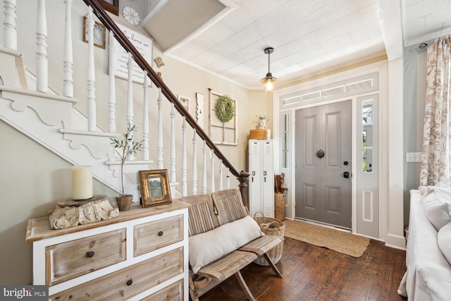 389 Cypress St, Millington, MD 21651 - foyer entrance featuring dark wood-style flooring, stairs, and ornamental molding
