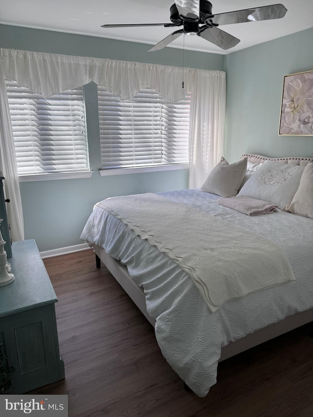 10 Malibu Ct, Towson, MD 21204 - bedroom with wood finished floors, multiple windows, baseboards, and a ceiling fan