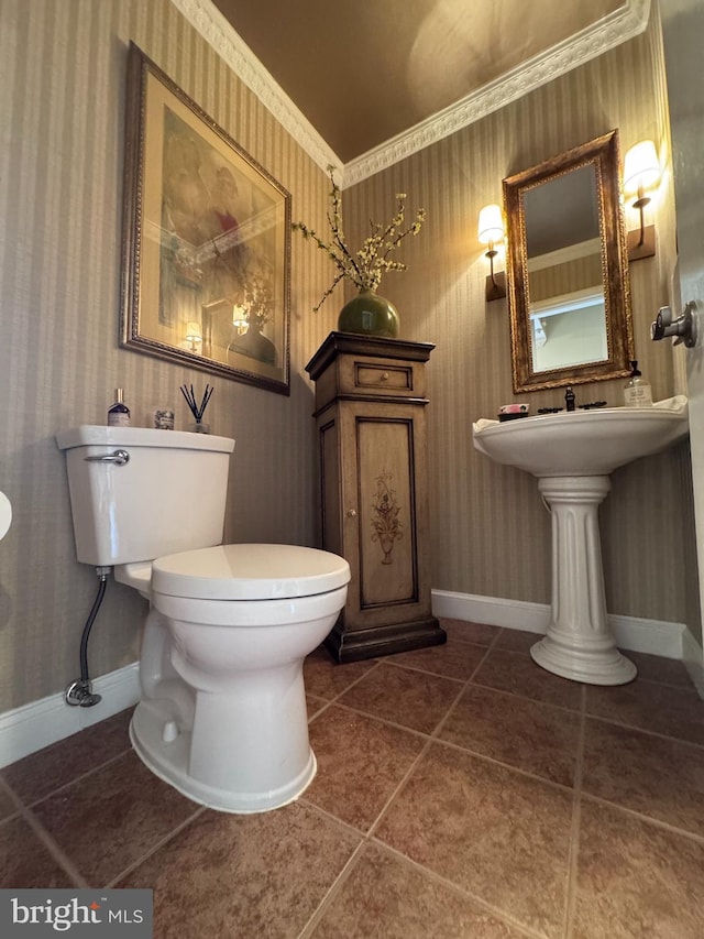 10 Malibu Ct, Towson, MD 21204 - half bathroom with wallpapered walls, tile patterned flooring, toilet, and baseboards