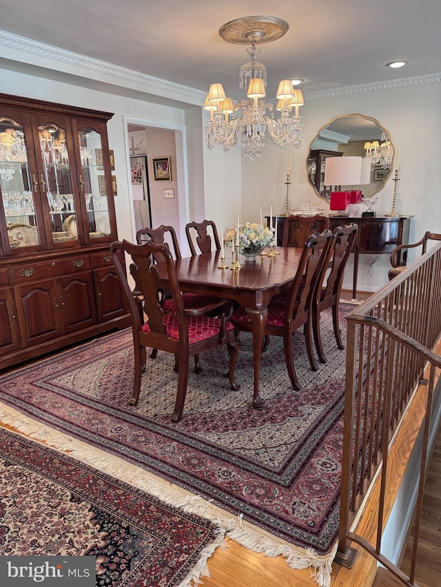 10 Malibu Ct, Towson, MD 21204 - dining space with a chandelier, crown molding, arched walkways, and wood finished floors