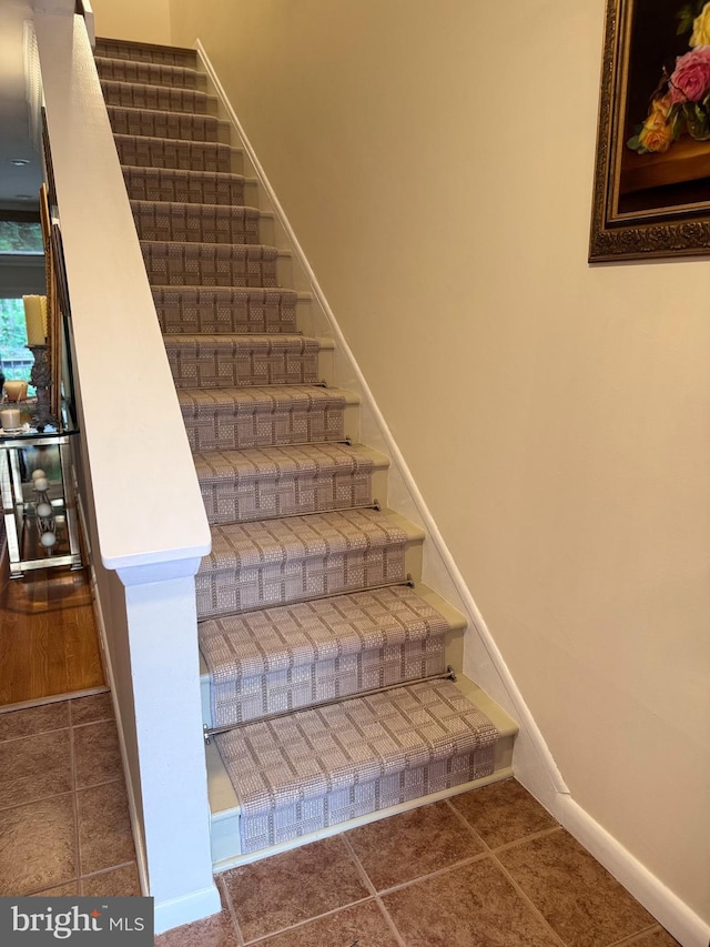 10 Malibu Ct, Towson, MD 21204 - stairway with baseboards and tile patterned flooring
