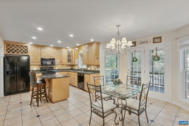 14 Patriot Ln, Palmyra, VA 22963 - kitchen with black appliances, light brown cabinetry, decorative backsplash, a center island, and recessed lighting