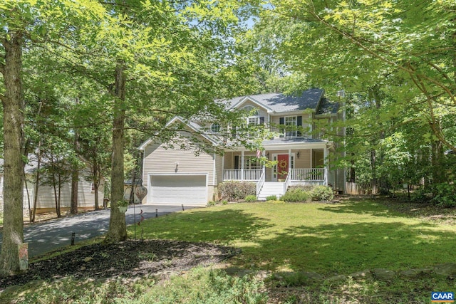 14 Patriot Ln, Palmyra, VA 22963 - traditional-style home with covered porch, concrete driveway, a front yard, and an attached garage