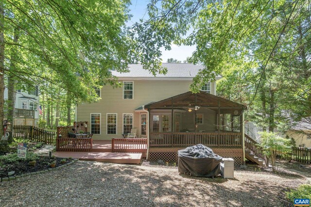 14 Patriot Ln, Palmyra, VA 22963 - back of property featuring a wooden deck and a sunroom
