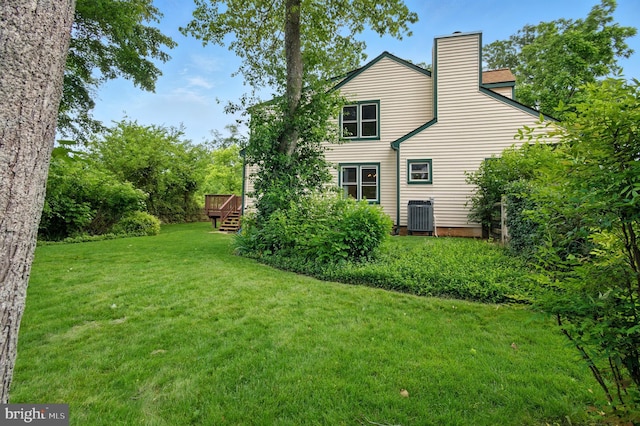 5762 Lichenbark Cir, New Market, MD 21774 - rear view of property featuring a lawn, a chimney, a deck, and central AC