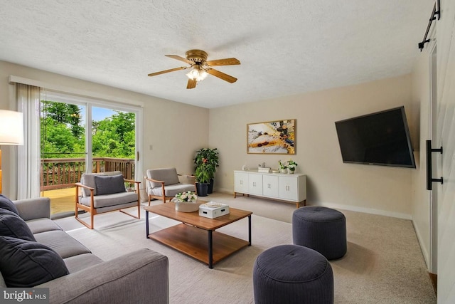 5762 Lichenbark Cir, New Market, MD 21774 - carpeted living area with a ceiling fan, a textured ceiling, and baseboards