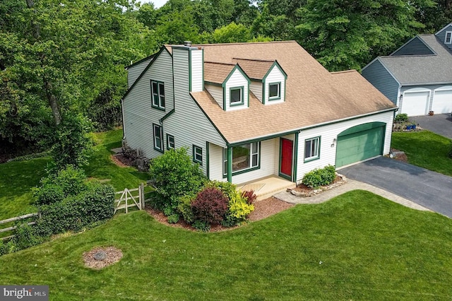 5762 Lichenbark Cir, New Market, MD 21774 - cape cod-style house featuring asphalt driveway, an attached garage, roof with shingles, and a chimney
