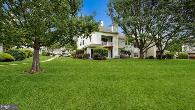 1703 Hopkins Ct, Southampton, PA 18966 - view of front of house with a chimney, a balcony, and a front yard