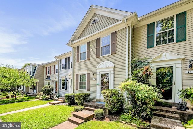 49 Huntley Ct, Sterling, VA 20165 - townhome / multi-family property with entry steps and a front yard