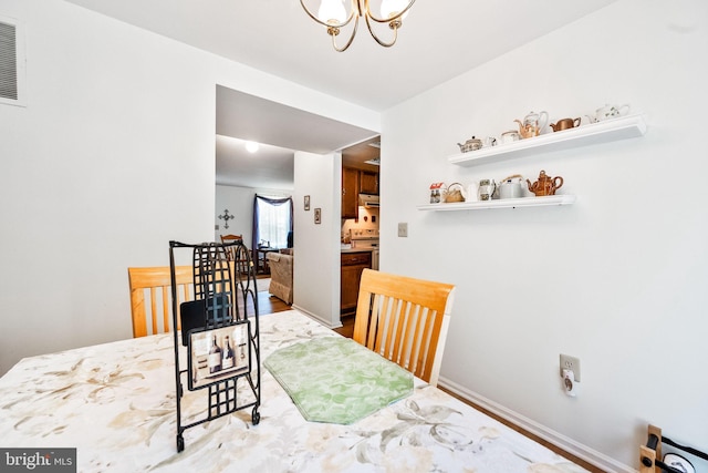 49 Huntley Ct, Sterling, VA 20165 - dining area featuring a chandelier and baseboards