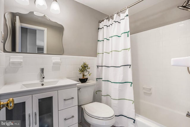 600 Roosevelt Blvd Unit 510, Falls Church, VA 22044 - bathroom featuring shower / tub combo, vanity, tile walls, and a wainscoted wall