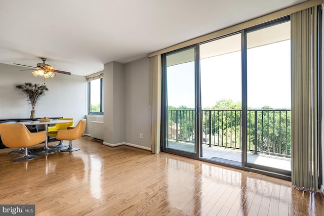 600 Roosevelt Blvd Unit 510, Falls Church, VA 22044 - living room featuring wood finished floors, a ceiling fan, and expansive windows
