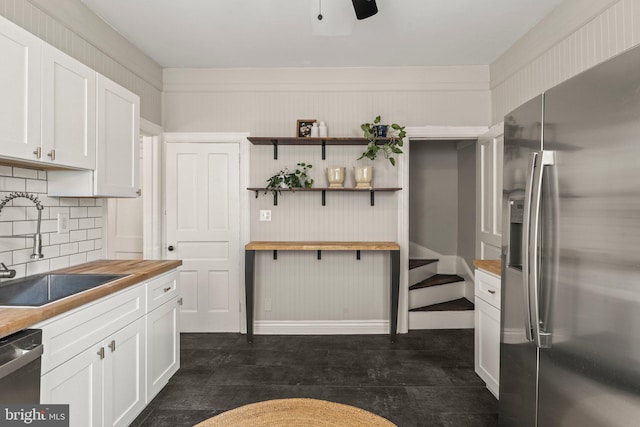 327 W Fourth St, Media, PA 19063 - kitchen featuring appliances with stainless steel finishes, butcher block counters, a sink, tasteful backsplash, and white cabinets