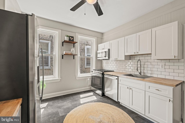 327 W Fourth St, Media, PA 19063 - kitchen featuring appliances with stainless steel finishes, butcher block counters, a sink, and ceiling fan